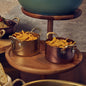 Vintage copper casserole dish with gold handles. Various sizes. Set of 6.